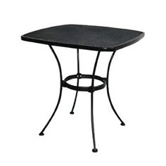 an outdoor table with a black top and metal legs, on a white background stock photo