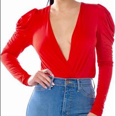 Red Plunge Neckline Bodysuit Long Sleeve Flirty V-neck Bodysuit For Party, Fitted Red V-neck Bodysuit, Red Fitted V-neck Bodysuit, Red V-neck Bodysuit For Spring, Spring Red V-neck Bodysuit, Trendy V-neck Bodysuit For Party, Chic Red Backless Top, Solid V-neck Bodysuit For Club, Chic V-neck Bodysuit For Club