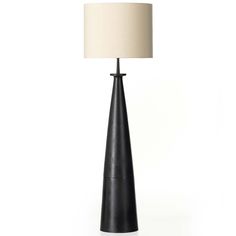 a black table lamp with a white shade on the base and a beige fabric lampshade