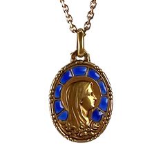 An 18 karat (18K) yellow gold charm pendant set with plique a jour blue enamel designed as the Virgin Mary with a motif of roses. Engraved with a monogram for SJ and the date 31-12-1935. Stamped with the eagle mark for 18 karat gold and French manufacture with an unknown makers mark.   Dimensions: 2.3 x 1.6 x 0.1 cm (not including jump ring) Weight: 2.62 grams  (Chain not included) Plique A Jour, The Virgin Mary, Gold Charm, Virgin Mary, Pendant Set, Makers Mark, Pocket Watch, Charm Pendant, Art Nouveau