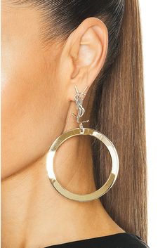 Find SAINT LAURENT Ysl Hoop Earrings In Metallic Gold on Editorialist. Saint Laurent YSL Hoop Earrings in Metallic Gold Gold-tone metal with cassandre logo. Made in Italy. Post-back closure. Measures approx 3.5 dangling. SLAU-WL201. 784142-Y1500-8030. About the designer: SAINT LAURENT has been influencing and revolutionizing the fashion industry since the debut of its iconic ‘Rive Gauche’ collection in 1966 - the couture house was the first to create a ready-to-wear capsule. The sleek, precisely Ysl Earrings, Ysl Handbags, Biker Jackets, Anthony Vaccarello, Link Earrings, Rive Gauche, Beauty Sale, Square Earrings, Fashion Industry