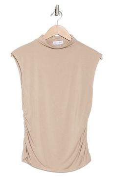 A mock neck and subtle side seam ruching styles this sleeveless top crafted from soft and stretchy knit fabric. Mock neck Sleeveless 95% rayon, 5% polyester Dry clean Imported Versatile Sleeveless Mock Neck Top For Spring, Casual Sleeveless Mock Neck Top For Layering, Solid Sleeveless Stretch Mock Neck Top, Stretch Sleeveless Mock Neck Top For Layering, Beige Ruched Stretch Top, Spring Sleeveless Mock Neck Top, Summer Sleeveless Stretch Mock Neck Top, Sleeveless Ruched Beige Tops, Summer Stretch Sleeveless Mock Neck Top