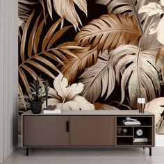 a living room with a large wall mural featuring tropical leaves