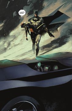 batman flying over the top of a car