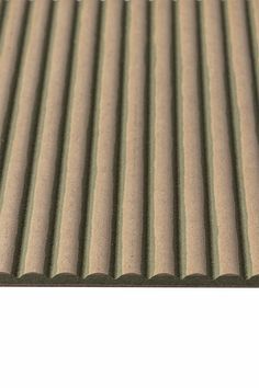 an image of a close up view of a corrugated roofing sheet with vertical lines on it