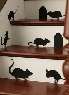 the silhouettes of mice are on the stairs in this house's stairwell area