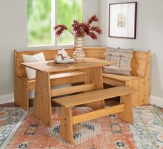 a corner table and bench in a living room