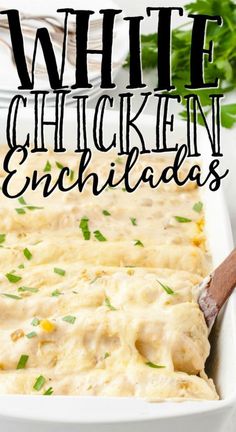 white chicken enchiladas in a casserole dish with a wooden spoon