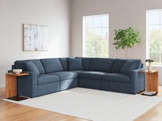 a living room with a blue sectional couch