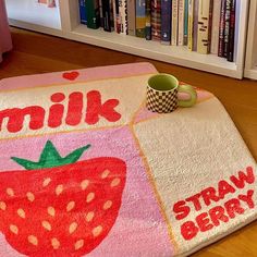 a strawberry themed rug with the words milk, strawberries and coffee mug on it