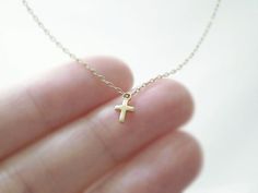 Tiny gold cross necklace gold filled chain simple by illusy, $23.00 Dainty 14k Gold Cross Necklace With Delicate Chain, Dainty 14k Gold Cross Necklace, Dainty Yellow Gold Cross Necklace For Everyday, Dainty Cross Necklace With Delicate Chain For Everyday, Dainty Everyday Cross Necklace With Delicate Chain, Dainty 14k Gold-filled Cross Necklace, Dainty 14k Gold Cross Necklace For Everyday, Dainty Everyday 14k Gold Cross Necklace, Dainty 14k Gold Cross Pendant Charm Necklace