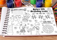 a birthday planner with lots of markers and crayons on the table next to it