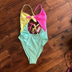 Cutout One Piece Swimsuit: Brand: Target/Xhilaration Item: Cut Out Multi Color One Piece Swimsuit Color: Pink, Yellow, Mint/Light Green Size: Small (0-2) Condition: Nwt Never Worn Has Small Removable Pads In Top Area, The Tie Can Come Undone But Not Removed, Tie Back Super Cute Swimsuit, In Perfect Condition *Please No Returns They Are Annoying And Inconvenient, Thank You! Trendy Neon Yellow Swimwear For Spring, Trendy Neon Yellow Swimwear, Neon Yellow One-piece Beach Swimwear, Neon Yellow One-piece Swimwear For Swimming, Neon Yellow One-piece Swimwear For Summer, Cutout One Piece, Come Undone, Cute Swimsuits, Tie Back