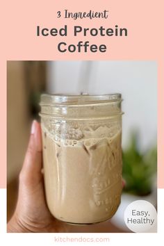 a hand holding a mason jar filled with iced protein coffee and text overlay reads 3 ingredient iced protein coffee