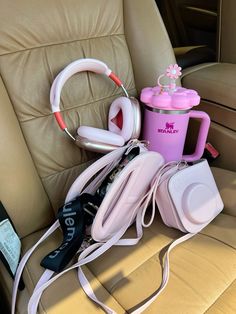 headphones and other items are sitting in the back seat of a car on display