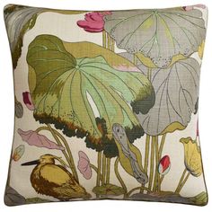 a bird sitting on top of a pillow with flowers and leaves around it's edges