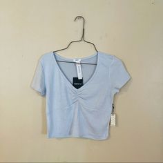 Brand New With Tags. Light Blue Color. Super Soft And Stretchy Knit Material. Cropped Length. Trendy Light Wash V-neck Top, Fitted Light Blue Cropped Top, Casual Light Blue Cropped Crop Top, Casual Light Blue V-neck Crop Top, Light Blue V-neck Casual Crop Top, Chic Blue Forever 21 Top, Light Blue Seamless Sleeveless Crop Top, Barbie Crop Top, Forever 21 Blue Cropped Tops