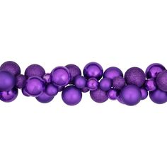 purple christmas balls are lined up on a white background