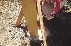 there is a wooden pole that has been dug into the ground by someone with a shovel