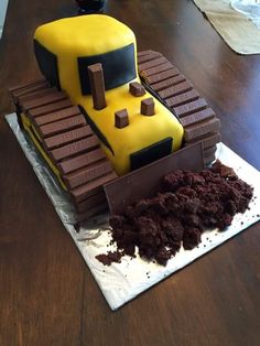 a cake made to look like a construction vehicle with chocolate chunks on the front and sides