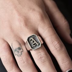 A handmade sterling silver 925 initial octagon shape signet ring with a frame and 3D letter and an oxidized background. Each ring is cleaned and polished with care. The weight of the ring may vary according to size. Top measurements: Width - 14.5mm | Height - 16.5mm Approx weight: 9.18gr This awesome ring is available in more shapes! Click here to see: Rectangle: https://www.etsy.com/il-en/listing/568045759/letter-initial-signet-ring-silver-letter Round: https://www.etsy.com/il-en/listing/568044 Luxury Men's Initial Ring With Engraving Option, Luxury Heirloom Men's Ring With Initials, Luxury Men's Initial Promise Ring, Signet Ring Silver, Old English Letters, Word Ring, Ring Initial, Medieval Rings, Ring Boy