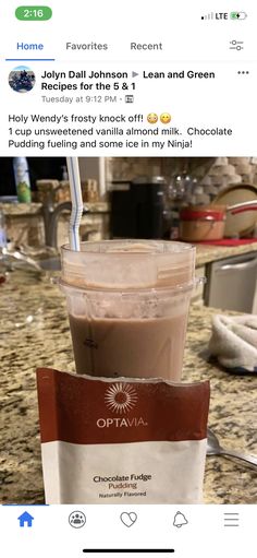 a cup of coffee sitting on top of a counter next to a bag of chocolate chips