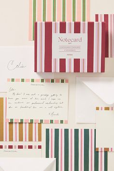 several different types of stationery and envelopes on top of each other, including one with a notecard