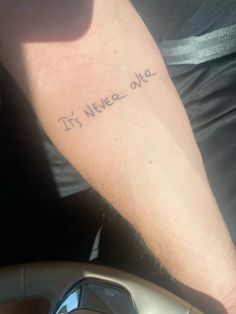 a man's arm with the words it's never ok written on it