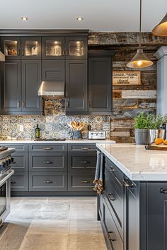 a kitchen with gray cabinets and marble counter tops