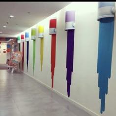 an empty hallway with colorful paint on the walls