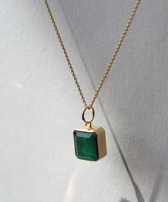 An emerald cut emerald set in 14k yellow gold. Each emerald has colors and textures unique to each stone. Specifications: 4 ct emerald set in 14k yellow gold. Stone is approximately 9.5x11 mm. Chain sold separately. Browse other chains here. Add our Carabiner to complete your look. Emerald Set, Bezel Necklace, Tourmaline Pendant, Bezel Pendant, Gold Stone, Yellow Gold Chain, Pear Diamond, Diamond Studs, Emerald Cut