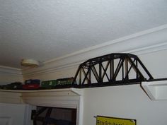 there is a train going over the bridge on top of the wall above the door