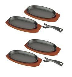 three metal trays with tongs on top of each one in front of a white background