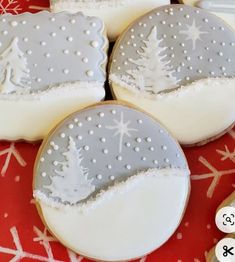 decorated cookies with frosting and trees on them