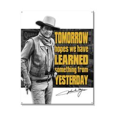 a man with a cowboy hat standing in front of a sign that says tomorrow hopes we have learned something from yesterday