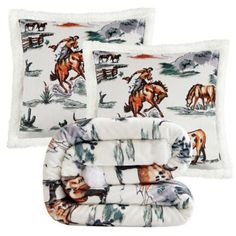 three pillows and two blankets with horses on them