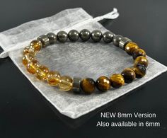 ❤️ Genuine Gemstone Stretchable Bracelet Made to Order with Pyrite , Tiger Eye and Citrine Crystals. 6mm , 8mm or 10mm This Abundance Bracelet is a potent amulet for good fortune made of numerous crystals, which give it metaphysical strength. When worn, it is supposed to attract wealth, success, and abundance to the wearer as well as make them luckier when playing games of chance! PYRITE Pyrite is a powerful protection stone which shields and protects against all forms of negative vibrations and/or energy, working on the physical, etheric, and emotional levels. It stimulates the intellect and enhances memory, helping to recall relevant information when needed. CITRINE Stimulates the brain, strengthening the intellect. Citrine promotes motivation, activates creativity and encourages self-ex Abundance Bracelet, Sacral Chakra Stones, Attract Abundance, Crystal Healing Bracelets, Attract Wealth, Protection Stones, Citrine Crystal, Minimalist Bracelet, Chakra Stones