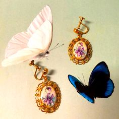 Nwotvintage Victorian Style With Screw Back Clips. They Are Made Of Golden Hardware And Embellished With Filigree Style In An Egg Shape Design Of A Stone Painted With Beautiful Lavender Florals And Baby Blue Colors. They Average About 1-1:2” Inches In Length. Estate Collection Vintage Purple Earrings, Violet Jewelry, Baby Blue Colour, An Egg, Egg Shape, Victorian Style, Stone Painting, Shape Design, Purple Gold