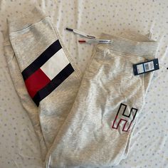 Super Cute And Unique, Very Soft And Comfy Sweatpants Kids Xl, Fits Like Women’s S/M Casual Tommy Hilfiger Bottoms For Loungewear, Casual Tommy Hilfiger Loungewear Bottoms, Tommy Hilfiger Casual Loungewear Bottoms, Tommy Hilfiger Cotton Bottoms For Loungewear, Tommy Hilfiger Tracksuit, Cream Sweatpants, Tommy Hilfiger Sweatpants, Tommy Hilfiger Joggers, Red Joggers