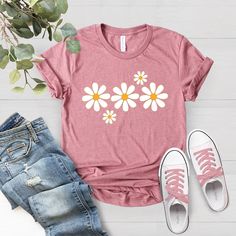 Daisies Flower Shirt, Spring Shirt, Flower Tee Summer Shirt, Soft Graphic Tee for Women, Floral Shirt, Comfy Shirt, Gardeber Shirt,Plant Tee F I T ∙ & ∙ S I Z I N G : -->These Unisex T-shirts have a modern-fit, consult size chart in pics for accurate fit -->Women's sizes are narrower than the waist -->Sleeves are rolled up in some product pictures, they do not come rolled up on delivery. T I M E ∙ T O ∙ D E L I V E R Y : -->Processing & production time is 1-2 business days. -->Delivery time vari Botanical Tshirt, Spring Tee, Vintage Floral Shirt, Wildflower Shirt, Spring Tees, Pink Shirts, Soft Graphic, Ladies Shirts, Comfy Shirts