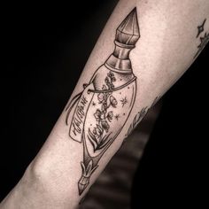 a woman's arm with a tattoo on it