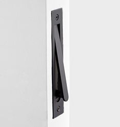 an open door with a black handle on it