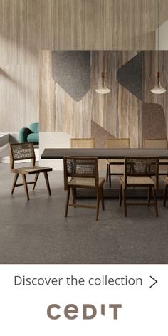 a dining room table and chairs in front of a wall with geometric designs on it