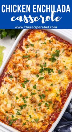 chicken enchilada casserole in a white dish with cilantro on the side