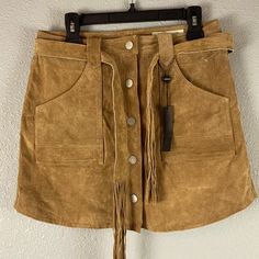 *Nwt Never Worn* Blank Nyc 100% Leather Suede, Button Front, Tan Mini Skirt W/ Belt. High Waisted, Snap Button Front Closure, Fully Lined, Fringe Belt, And Front Pockets And Back Pockets. - Size 29 - Color: Tan - Measurement Across Waist 16” - Measurement Across Hips 20”-20.5” - Measurement From Top To Bottom 17” Fall Leather Mini Skirt With Belt Loops, Fall Leather Skirt With Button Closure, Chic Fall Skirt With Snap Buttons, Chic Skirt With Snap Buttons For Fall, Fall Mini Skirt With Snap Buttons, Leather Skirt With Belt Loops For Fall, Tan Mini Skirt, Brown Suede Skirt, Fringe Belt