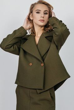 This Fatale smart casual jacket is made in slightly oversized fit. Featuring two buttons at the front and a glamorous collar, you can style it with our wide trousers or a midi length skirt that are made of same Italian fabric. * 13% Viscose 86% Polyester 1% Elastane   * Fabric country of origin: Italy * Model is 174cm/5'9, 55 kg and is wearing size S/M 34(EU)/40(EU) * Made in Lithuania Items are packed in a gift box with a stylized postcard.  We accept exchanges and returns on all items, any que Notch Lapel Cropped Jacket For Work In Fall, Fall Cropped Jacket With Notch Lapel For Work, Chic Office Cropped Jacket With Collar, Workwear Cropped Jacket With Notch Lapel, Workwear Cropped Jacket With Lapel Collar And Button Cuffs, Workwear Cropped Jacket With Double Button And Notch Lapel, Spring Workwear Pea Coat With Lapel Collar, Fall Cropped Jacket With Single Breasted Suit Collar, Fall Single Breasted Cropped Jacket With Suit Collar