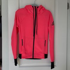 Nwot Adidas Track Hoodie Jacket Xs. Gorgeous Bright Coral Pink Color With Black Adidas Logo And Trim And Zipper. Jacket Features Thumb Holes. Sporty Hooded Jacket For Cold Weather Fall Season, Sporty Hooded Jacket For Cold Weather In Fall, Sporty Hooded Fleece Jacket, Sporty Fleece Jacket With Drawstring Hood For Fall, Adidas Sports Sweatshirt With Double-lined Hood, Adidas Sweatshirt With Double-lined Hood For Sports, Fall Sportswear Hooded Fleece Jacket, Fleece Long Sleeve Track Jacket With Drawstring Hood, Fall Sportswear Hooded Jacket With Fleece Lining