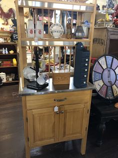 a kitchen island with lots of items on top of it in a room filled with other things