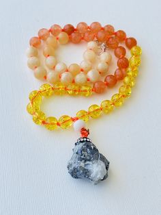 I am motivated to pursue my true purpose. I am comfortable with my power. I am ambitious and capable of whatever I desire. My solar plexus chakra is balanced. This purchase includes: Gemstone Mala, baggie, box, card including using your mala, intention setting and properties. GEMSTONES Calcite: Like an energetic vitamin, Calcite helps to keep your energy at its highest potential by removing energetic blocks and clearing negativity. It raises your vibration and uplifts your spirit, making it an e Adjustable Gemstone Beaded Necklace For Meditation, Pendant Crystal Necklace With Gemstone Beads For Meditation, Meditation Necklace With Natural Stones And Mineral Crystal, Fusion Style Meditation Necklace With Natural Stones, Spiritual Amber Crystal Necklaces With Round Beads, Amber Crystal Necklace For Meditation With Natural Stones, Spiritual Gemstone Necklaces For Meditation, Spiritual Amber Crystal Necklaces With Gemstones, Gemstone Beaded Necklace For Meditation