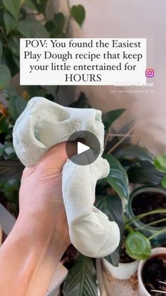 a person holding up a fake doughnut in front of some potted plants with the caption pov you found the easter play dough recipe that keep your little entertained for hours